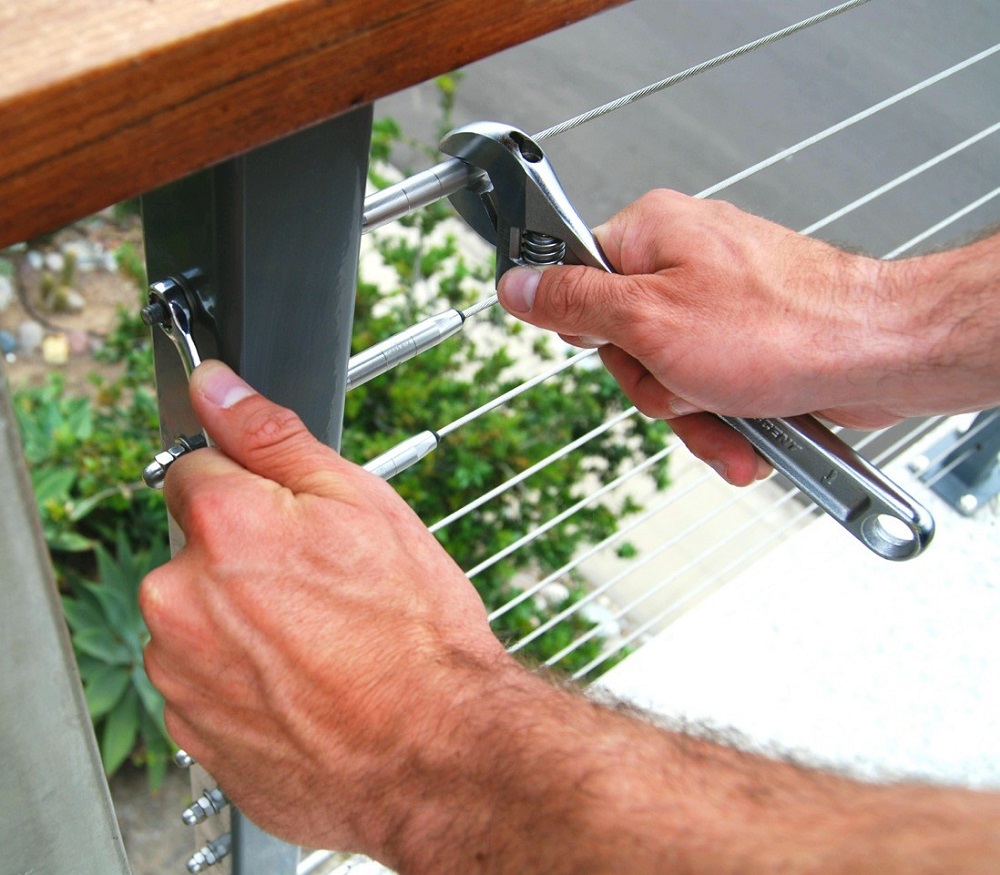 Swageless fittings cost more than machine- or hand-swaged fittings, but don't require any special installation tools and are available at many lumberyards and home improvement centers.