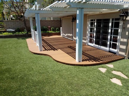 With the MDF template as a guide, the decking can be accurately trimmed with either a small circular saw or a router (for tighter curves) to follow the curved rim joist.