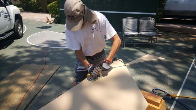Here, the author is using a small circular saw to trim an MDF template to the scribed line. He'll clean up and smooth out the cuts with a belt sander.