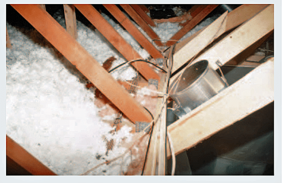 Figure 3. Cutting the bottom chord of the truss a little beyond the metal plate allowed the original truss web to provide some support for the drywall ceiling.
