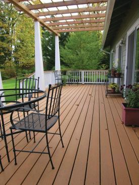 Tamko Evergrain uncapped composite decking has earned a reputation for being durable and a good value, even in the rainy climate of the Pacific Northwest. A comparatively low cost compared with other synthetic decking is uncapped's biggest attraction for buyers. Some homeowners also prefer its flatter surface sheen. It will dry out faster than capped decking or PVC because the fibers in the material cause water to spread out on the surface and evaporate more quickly. 