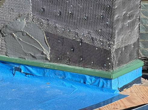 Through-flashing can be installed before the cladding. In this case, the author’s company has installed a peel-and-stick roof underlayment first.