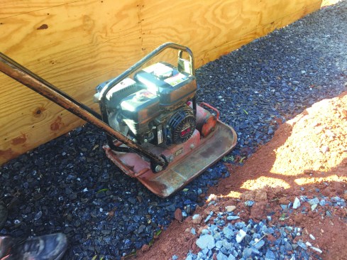 Gravel was placed in the bottom of the trench and leveled.