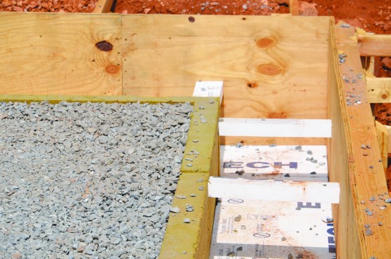 Then gravel was placed in the sub-slab area, and the Toprock DD back was braced using small pieces of polystyrene.