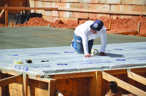 After finishing, the crew applied protective plastic over the slab to maintain good curing conditions.