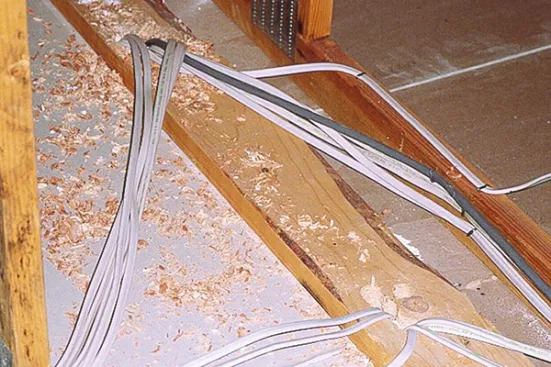 Top plates of partition walls in attics are huge sources of air leaks, made worse by all the electrical penetrations.