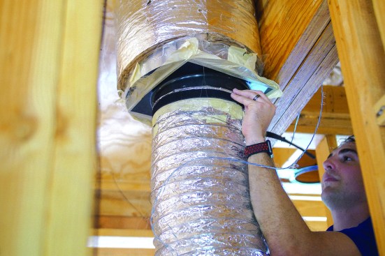 He seals the outside with tape.