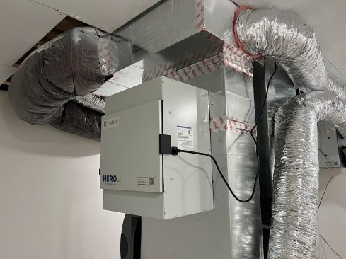 When an existing air handler is used, the simplest way to mount the Fantech HS300 is on the side of the vertical return duct before it turns and enters the air handler (above). Alternatively, knockouts in the filter’s housing allow the unit to be mounted farther from the air handler using 8-inch flexible ducts, as shown at right. This not only gets it out of the way but also helps limit sound transfer.