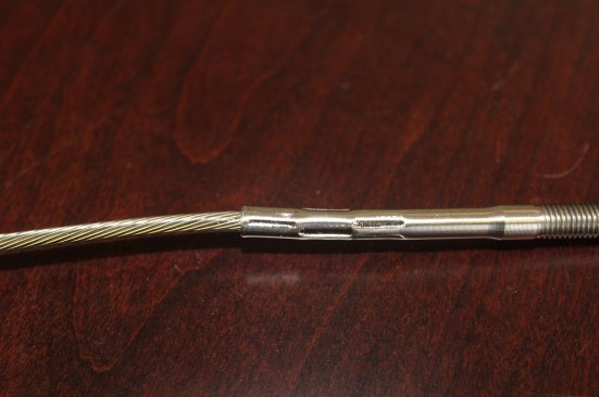 Field-swaged fittings are widely available and relatively inexpensive, but the crimp marks are noticeable and the fittings are susceptible to corrosion where the metal has been marred by the crimping tool.