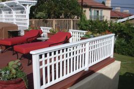 This railing was built with redwood and has a paint finish, though the same design could be built with reinforced composite balusters.