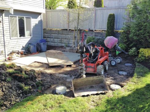 Ground-level hot tubs are typically supported by a concrete slab, which should be formed and poured at the same time as the deck footings.