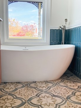 Similarly, the expressive stone and tile patterns in both the second-floor bath and the primary bath are in keeping with Victorian sensibilities.