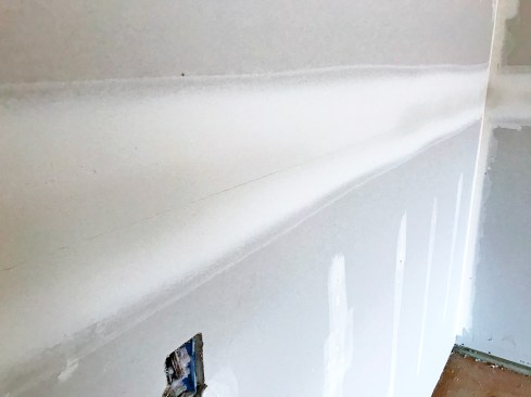This joint cracked because the second coat was applied before the first coat had cured. The building was not heated, which delayed curing.