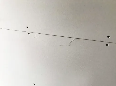 Broken edges need to be repaired (the broken area cut out and the void prefilled with a setting compound) before taping and finishing the seam.