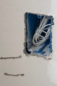 The cutout for this electrical box is overcut in the lower left corner. This and the gouges from sloppy handling of the cutout tool will need prefilling, tape and two coats of finish to fix.
