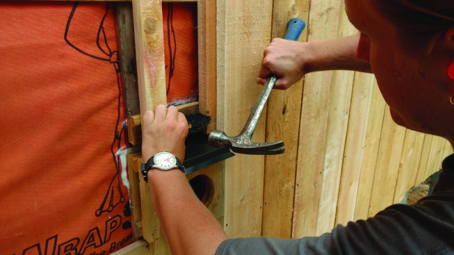 The reverse board-and-batten method creates a substantial air space behind the wood siding, allowing excellent seasonal drying potential. Air inlets behind the horizontal strapping are protected with screening.