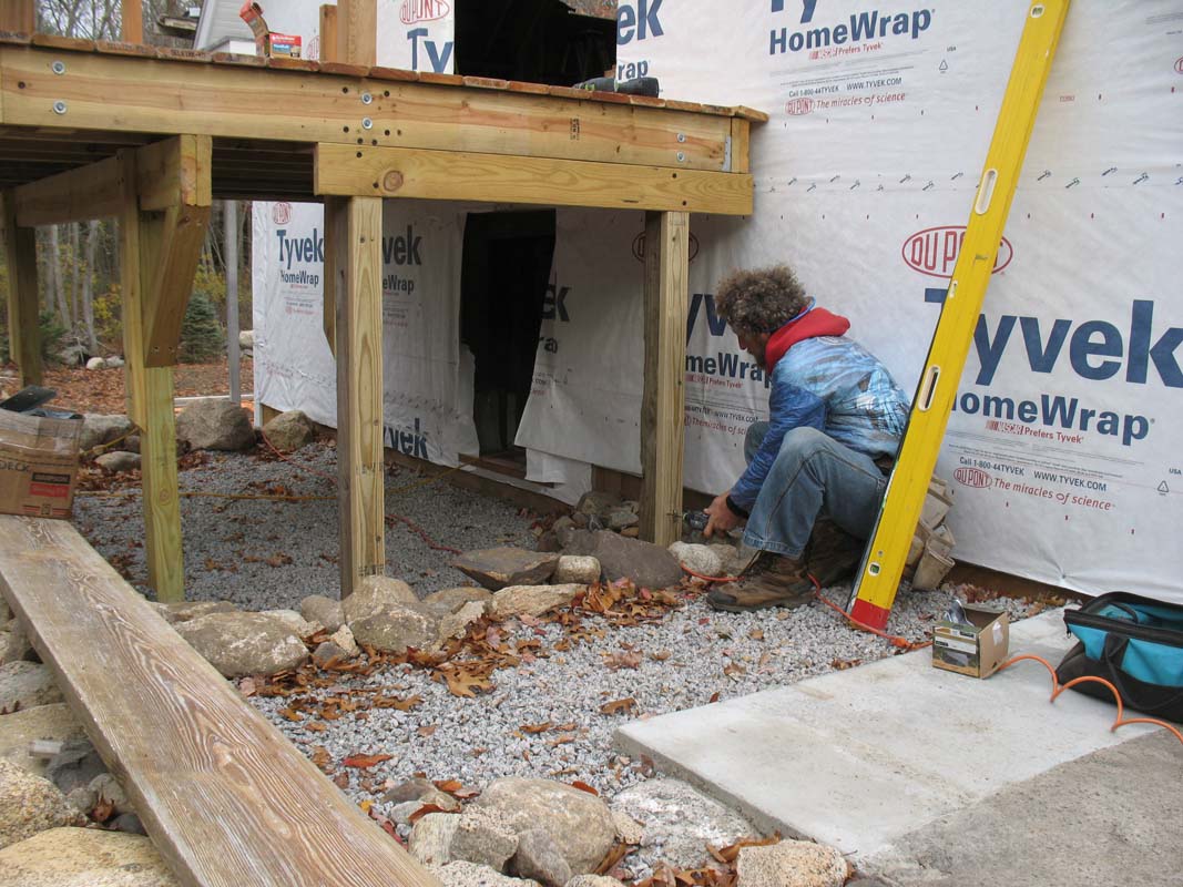 I prefer to support the head of stairs independently of the deck frame to avoid overloading an end joist or a rim joist.  Here a single 2x6 is screwed to 4x4 posts and supported by 2x4 jacks resting on top of footings.  The 2x6 is in plane with and provides additional support to the end joist of the deck.