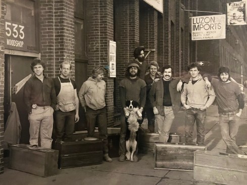 Outside Dixon Bros. Woodworking, circa1976. Jed stands in the center with Sam, the  shop dog.