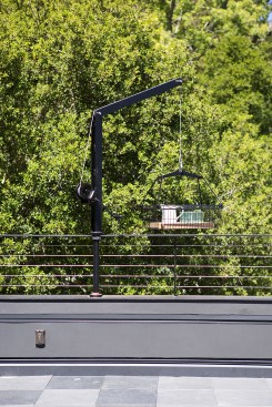 A uniquely designed boom and crank system delivers refreshments to the rooftop.