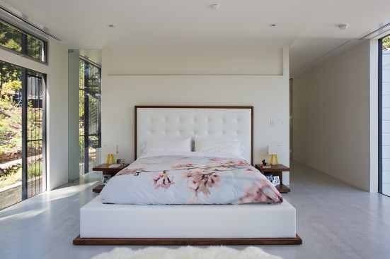 The open and clean addition of the remodel is perhaps best exemplified by the master suite with adjoined "wet room" that is separated by a pocket door.  