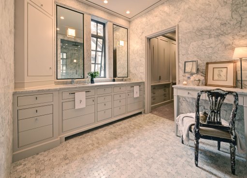 For this "marble box" bathroom design, DeRhodes Construction used honed Carrera marble throughout to lovely effect. Overhead recessed lighting by Lightolier (lightolier.com) illumates the space. See the&nbsp;full article&nbsp;about this award-winning project.