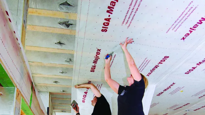 The author chose to use netting to contain the blown insulation, and then apply Majrex directional vapor control membrane as a control layer for air transport and diffusion of vapor, allowing the building to dry to the interior if needed.