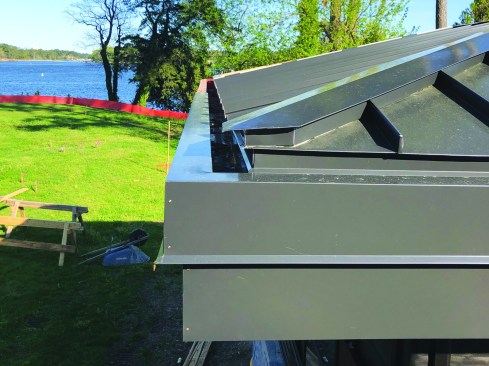 The final decision was to eliminate the foam and separate the panels from the sheathing with a high-temperature underlayment.