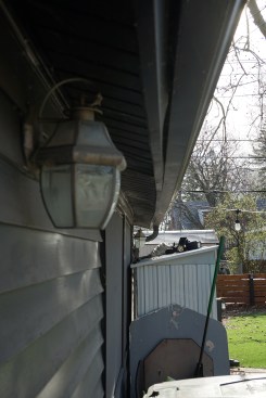 The bearing walls had been pushed out of plumb, causing the top plate to bow outward.