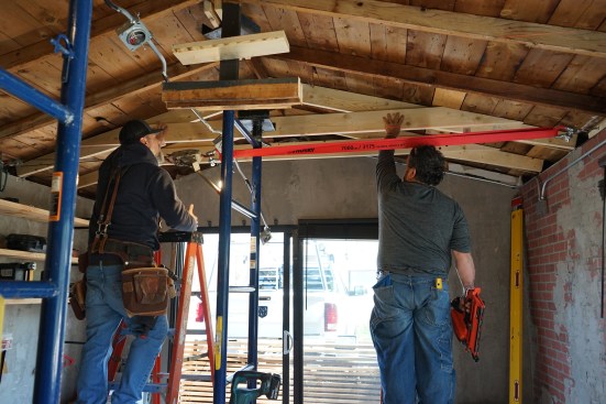To optimize headroom, the engineer allowed the crew to cut a slight taper on the underside of the sisters from the point where the rafter ties intersect to the end near the wall plates.