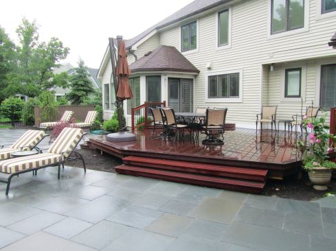 The deck has wide steps that allow traffic to flow easily between levels and that can serve as amphitheater seating around the pool as well. Omitting the railing (okay on decks lower than 30 inches above grade) helps unify the two areas and prevents the railing from inadvertently becoming the deck’s main architectural feature.
