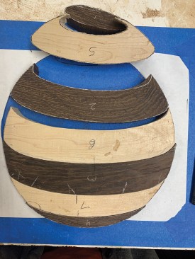 With the first cuts the author makes, you can see the illusion of depth created by the contrasting colors and attention to grain orientation.