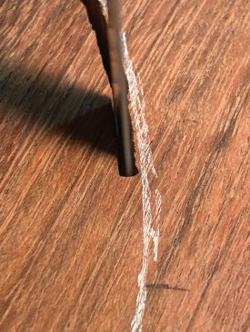 The author makes a side-cut in the Brazilian cherry that will have the bottom part of the ball set into it.