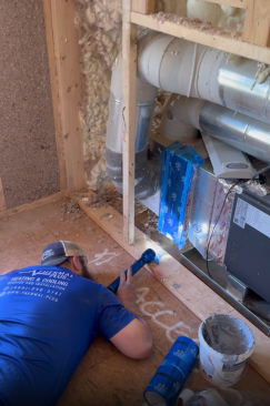 Chasing duct leaks behind the attic knee wall. The crew worked with the HVAC contractors over several days chasing theatrical-smoke trails to find and plug the leaks before they finally managed to get the duct leakage below the required 6% at pre-drywall.