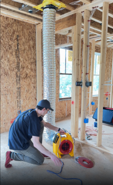 Retrotec’s Noah Lawrence assisting with pre-drywall duct testing. His initial tests did not go as planned—results showed approximately 12% duct leakage, which is three times the allowable amount for Zero Ready Energy Home certification.