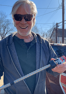 Queen of Zero Site Supervisor Matt Kulp marks the 18-inch drill bit with black electrical tape for the correct 12-inch embedment of threaded uplift support rods.