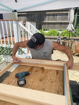 Marking the new width required for a 26-inch door on the header.