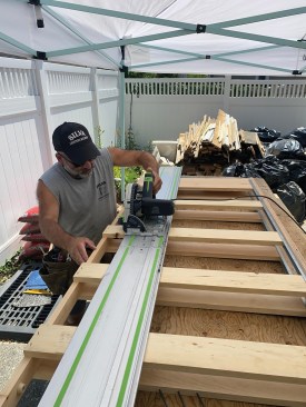 He then used the new jam to guide the placement of the track saw as he trimmed the frame to size.