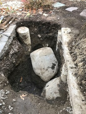 The original piers had been pinned to the boulders with rebar, making removal difficult.