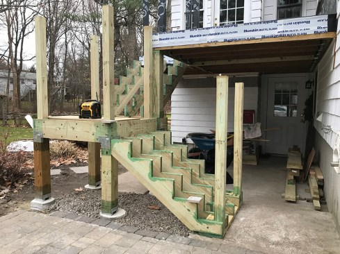 The landing and upper and lower stairs have been reframed and are ready for tread and riser installation.