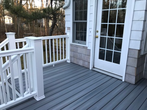 To accomodate the multiple flashing layers that were used to waterproof the 4x4 guard posts, the author installed composite post sleeves sized to fit 5x5 posts.