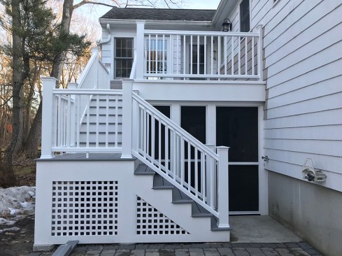 While the new deck looks similar to the old one, the dry area underneath was enclosed with screening.