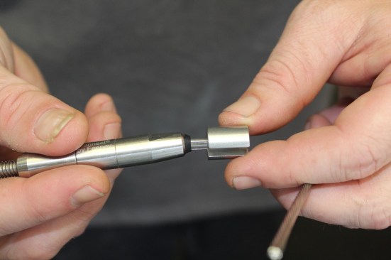 Swageless fittings utilize a small one-way locking mechanism that allows the cable to enter in one direction while grabbing the cable if pulled in the other direction. This technology is at times compared to a compression fitting. Reputable manufacturers of swageless fittings also test these mechanisms to achieve the breaking strength of the cable. Swageless fittings can be released with the use of another tool that depresses the mechanism and allows the cable to be released.