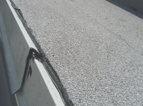 Critical low-slope details. Metal edges will move with temperature differences.