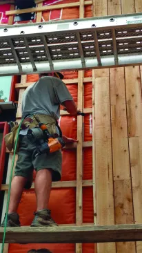 For a reverse board-and-batten cladding, the thin battens are
nailed onto the wall first.