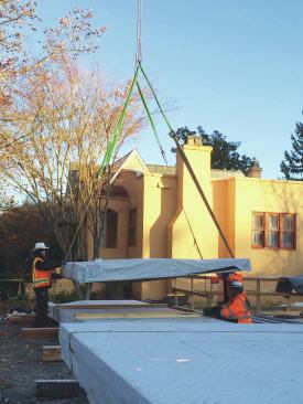 A CLT job is a logistics puzzle, and to do it profitably requires planning. At the start of the job, it took time to sort the panels with a crane, but stacking them in the order they would be used saved valuable crane time in the long run. 