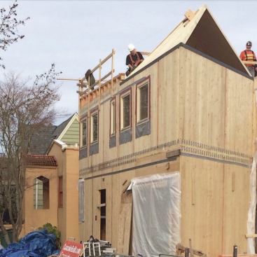 The engineer specified a series of closely spaced clips to secure the first- and second-floor wall panels to the intervening floor panel.