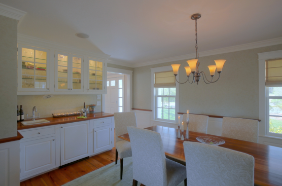 Accent. Lighted glass-front cabinets show off glassware. Glass shelving allows the light to shine through to the lowest shelf.