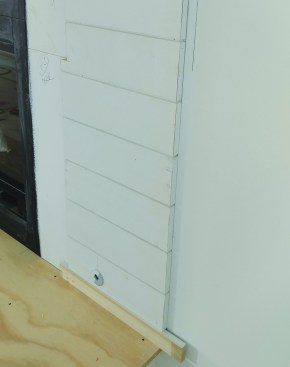 To terminate a run of shiplap in the field, the author uses mitered returns cut flat on a sliding compound miter saw.