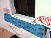 A key feature of a good window flashing is a drainable sill pan, which gathers the water leaking around a window unit and directs it to the outside. We find that a lot of masons, if left to their own devices, will let the sill pan drain into the air space behind the brick, leaving the through-wall flashing at the base of the wall to do all the work. However, we feel that best-practice should include a through-wall flashing right below each window that is integrated with the sill pan. Any water leaking from any window needs a clear path out of the wall as quickly as possible.