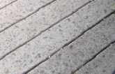Figure 2. Because composite decking contains wood, some brands may support mold growth. Depending on the proportion of wood flour to plastic resin and how the decking is manufactured, particles of mold-feeding wood may be exposed on the surface.